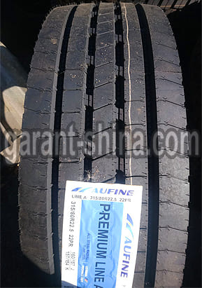 Aufine Premium Line A (рулевая) 315/80 R22.5 160/157J 22PR - Фото реального протектора с этикеткой вблизи